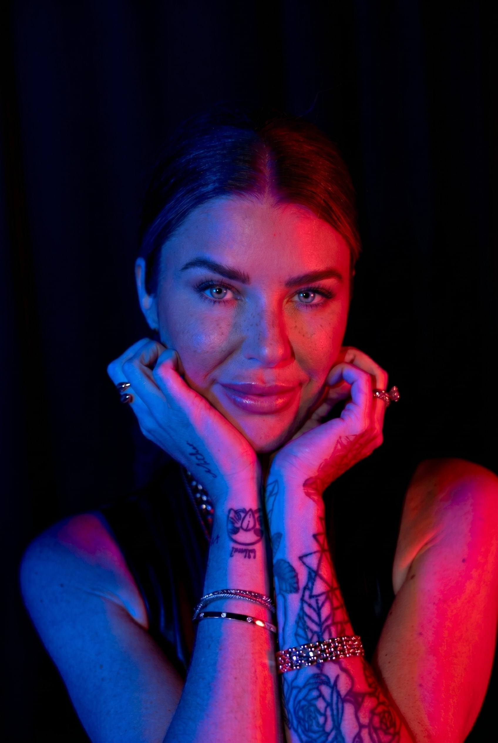 Ashley, lit in red and blue
